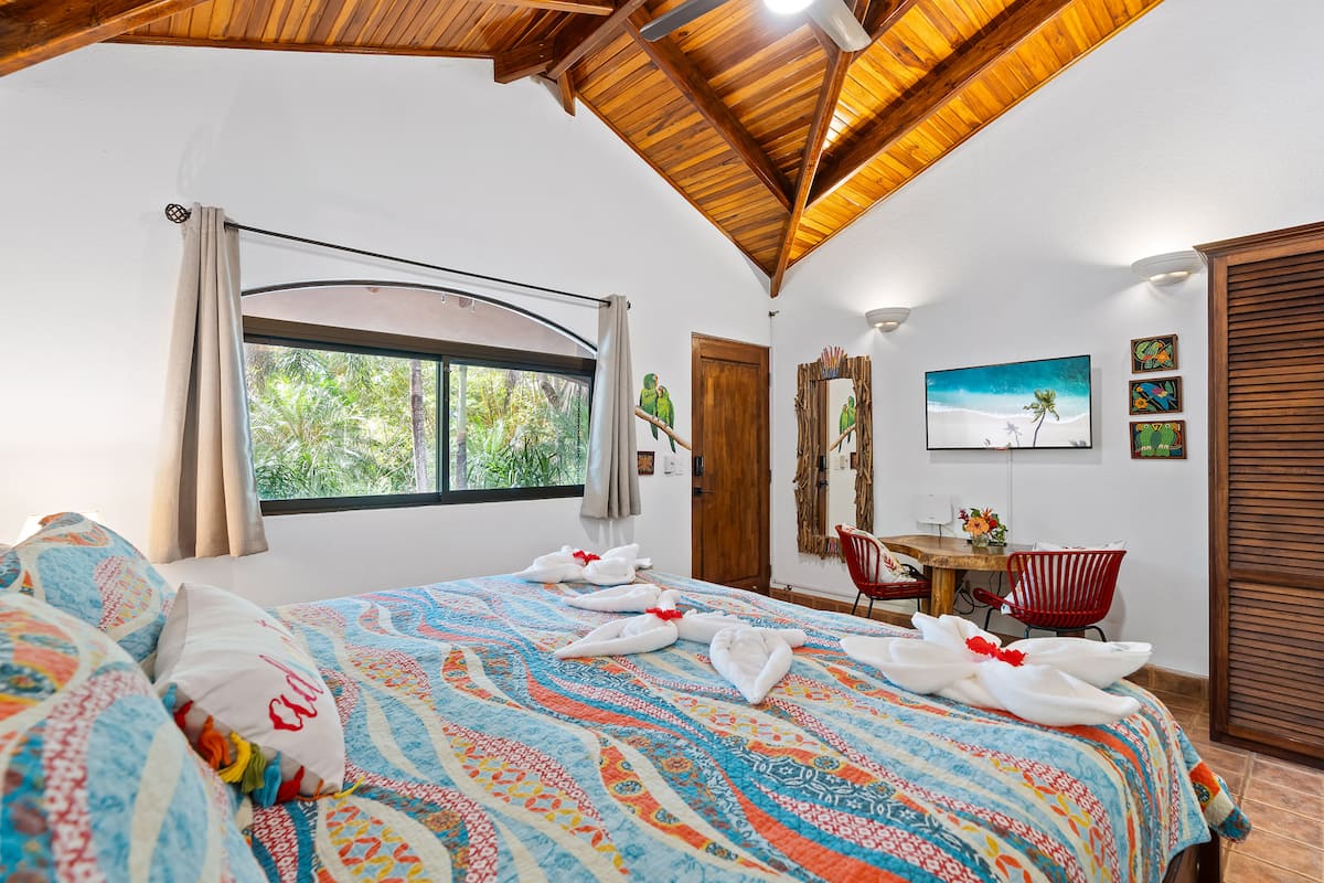Cosy bedroom inside one of the three jungle studio cabinas