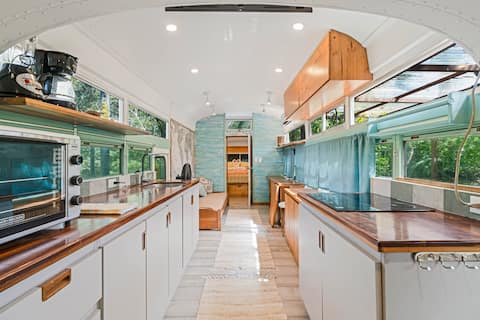 Living space inside Casa Maia, a converted school bus jungle home
