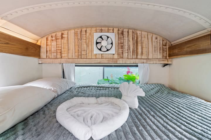 Interior of Casa Mila, a converted Bluebird school bus with bedroom